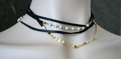 Judith Poe: (W) Black Leather with Pearl Wrap