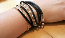 Judith Poe: (W) Black Leather with Pearl Wrap